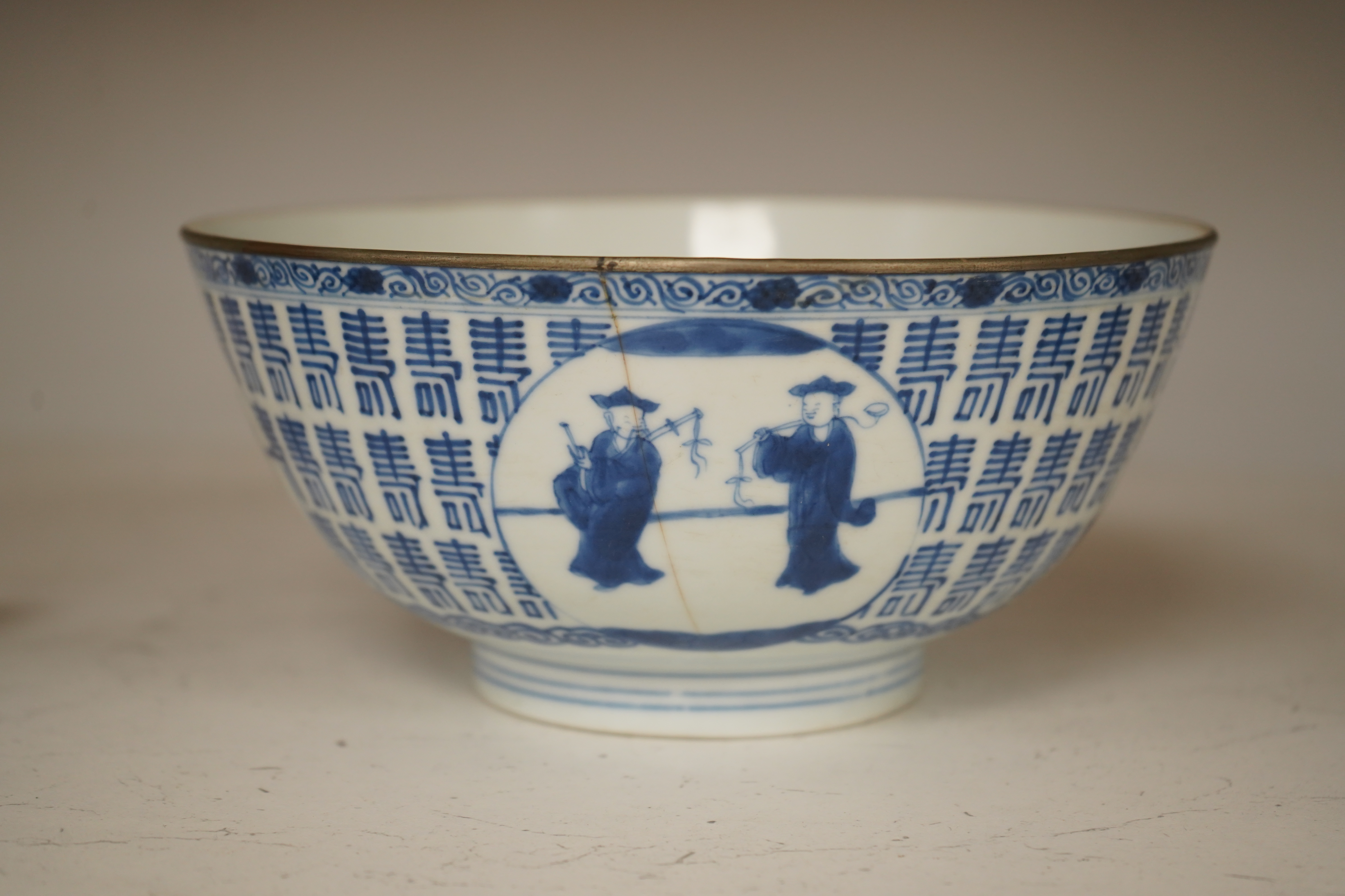 A Chinese blue and white ’Hundred Shou’ bowl, Qing dynasty, 20cm in diameter. Condition - cracked